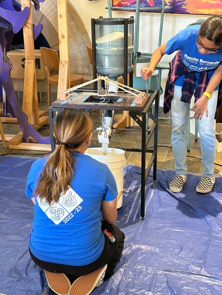 Antonette Chavez (left) and Preena Maruthavelu (right) test their bridge