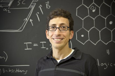 Jason Alicea in front of a chalkboard