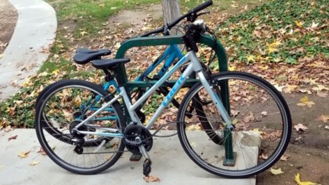 Two bikes locked to a rack