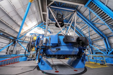 A portion of NEID, called the port adaptor, is seen here on the WIYN telescope.