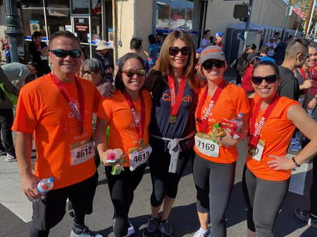 participants in the Firecracker Run wearing orange t-shirts