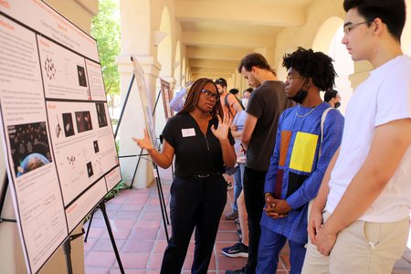 WAVE Scholar Christine Ohenzuwa, a senior at Princeton, shows how research she conducted may help spacecraft image and navigate their surroundings.