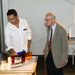 Rana Adhikari of Caltech and Rai Weiss of MIT discuss one of the new exhibits at the center.