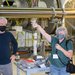 Mike Landry and Betsy Weaver of LIGO Hanford give visitors of a tour of the facility.