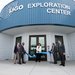 Picture of Amber trunk cutting the blue ribbon in front of the LIGO Exploration Center.