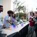 Graduate students demonstrate a science experiment involving liquid nitrogen.