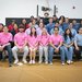 Five teams of students and an instructor sit on the bleachers following the ME72 competition.