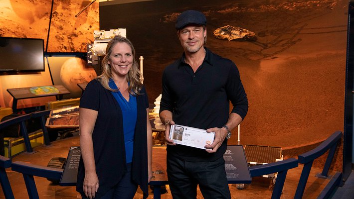 Brad Pitt shows off his boarding pass for Mars.