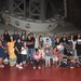 Members of the Pauma band pose inside the dome of the 200-inch Hale Telescope.