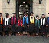 Photo showing the different types of academic regalia worn by graduating Caltech students.