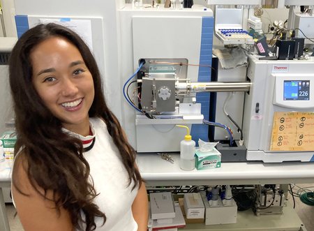 A woman in white shirt in a laboratory