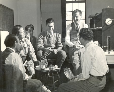 Mid-20th century scientists discussing phage