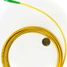 A yellow coiled cable with a quarter