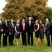 Scientists in formal wear stand for a photo